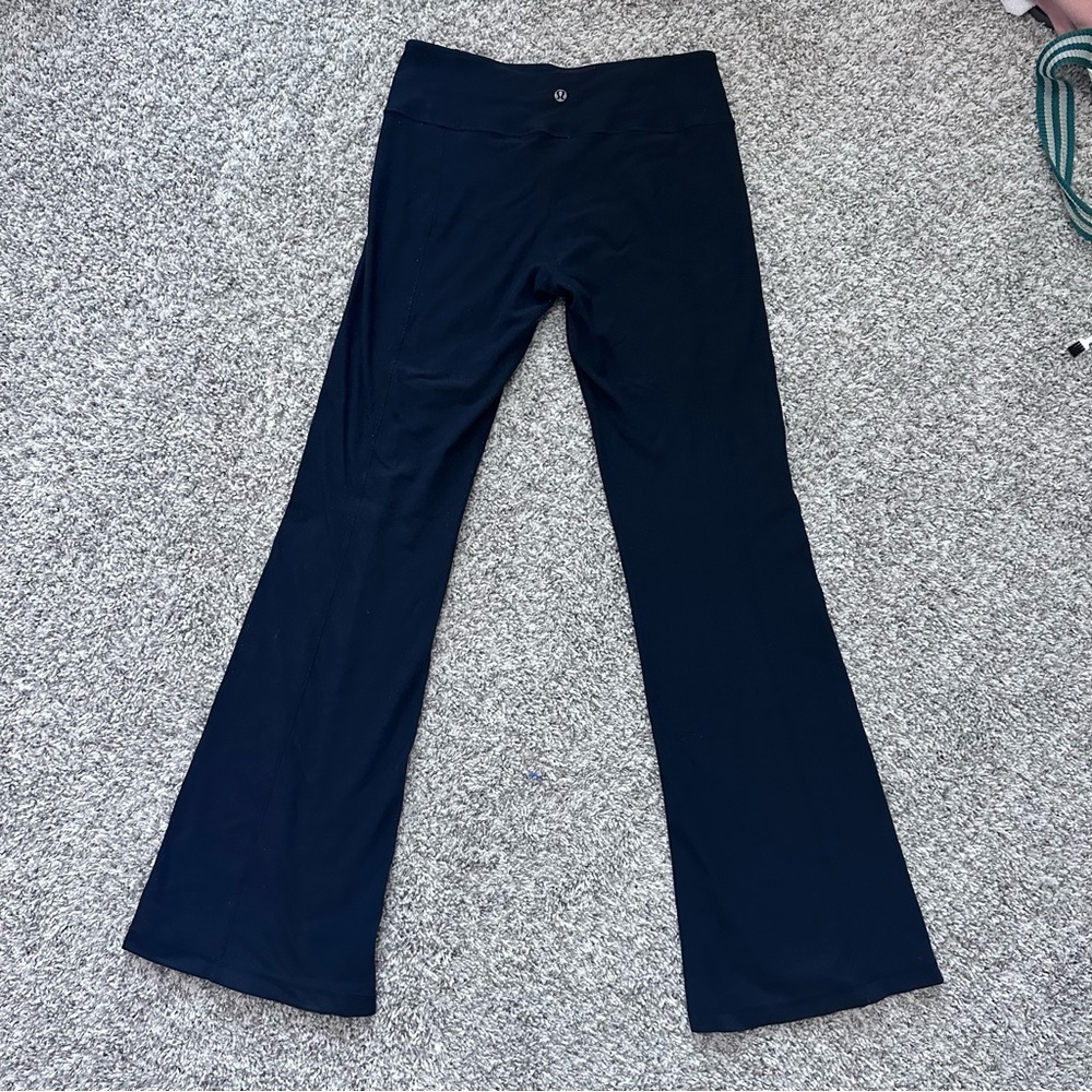 Vintage Y2K style Lululemon flare black leggings with colorful funky waistband